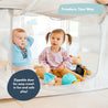 two children playing in a grey mesh side baby playpen with zipper door.