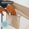 grey foldable baby playpen with mesh sides and storage pocket