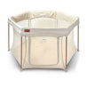 Beige baby playpen with mesh sides and zippable door panel